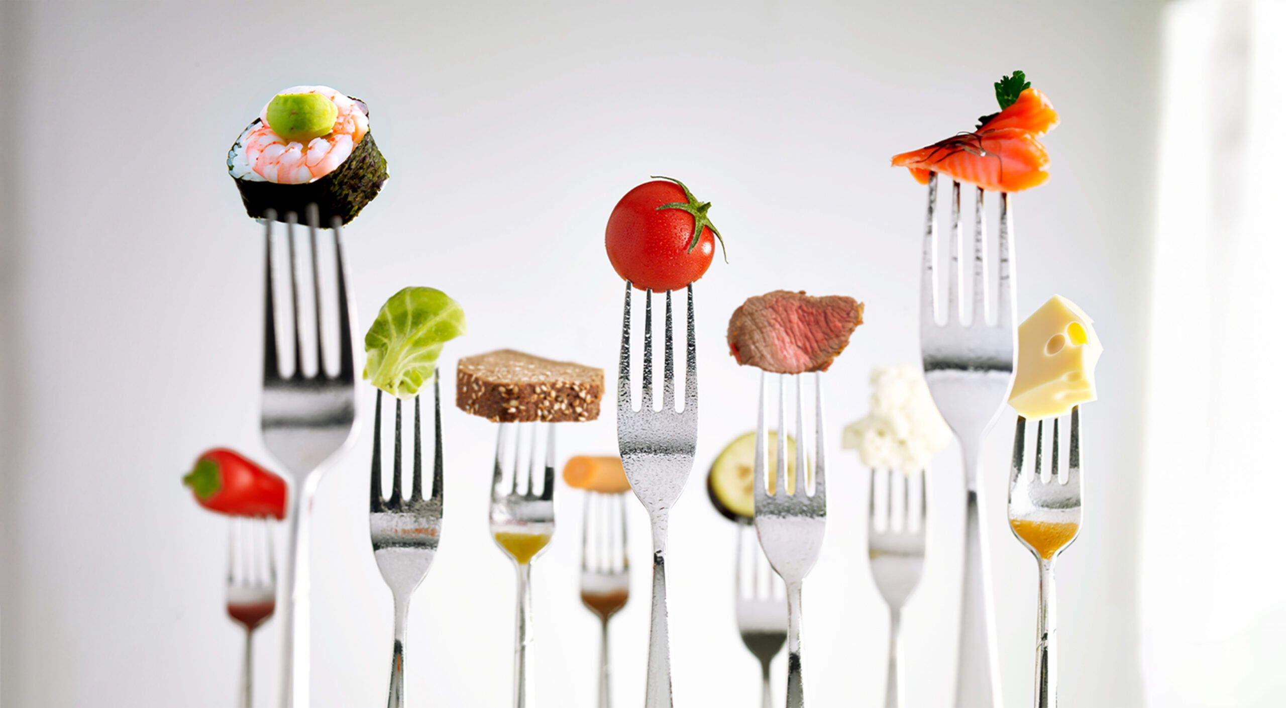 Different foods on forks