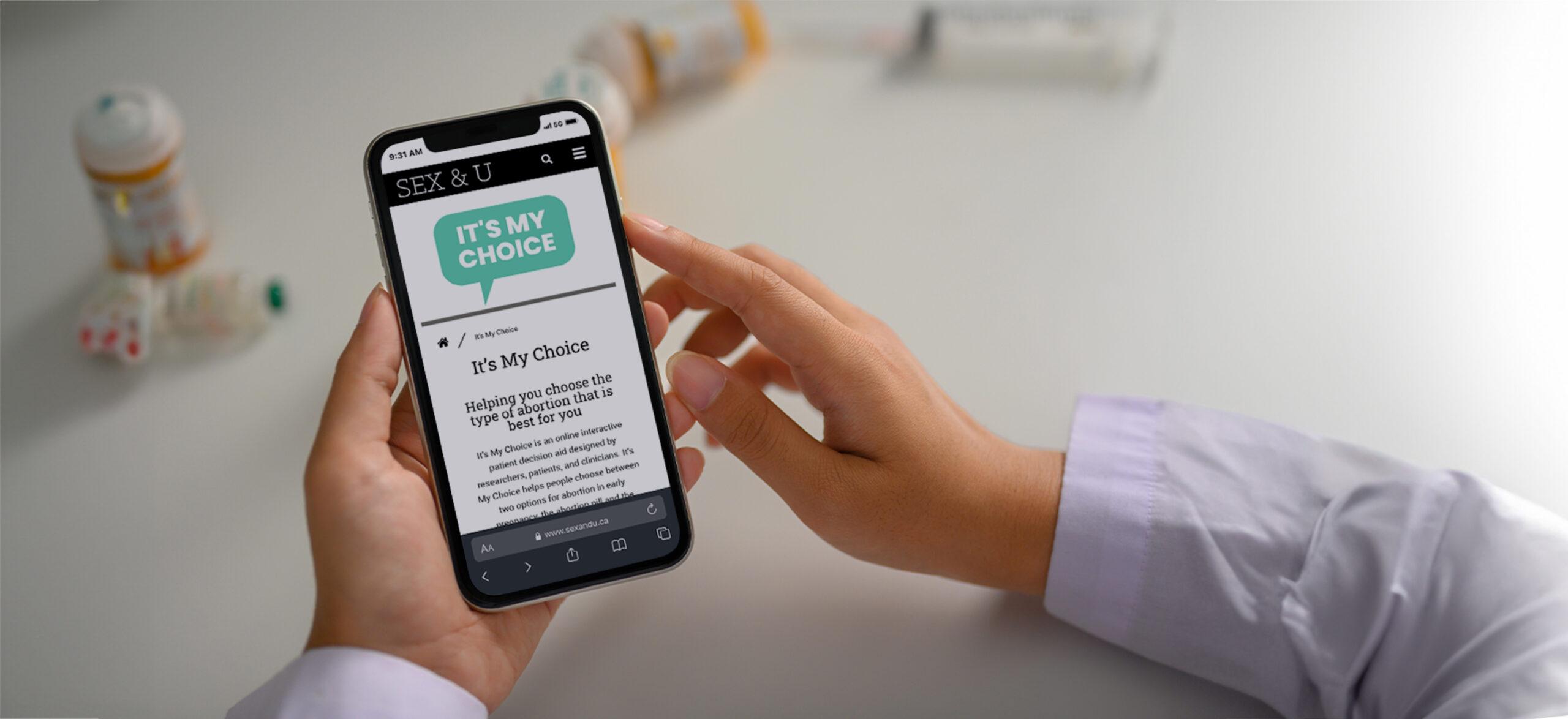 Doctor in a white coat browsing the 'It's My Choice' website.